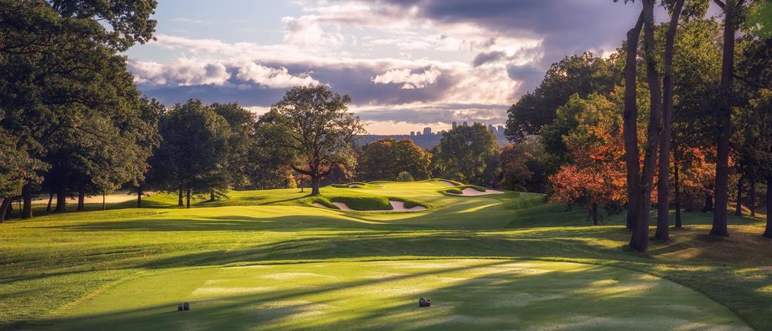 <b>Hole 5   |   Par 4   |   454 yards</b><br /> 
Play is down a gentle valley but unless you can find the upper plateau on the right, you are left with an approach to an angled green that falls away to the right. It’s not the clearly visible front bunkers that you should fear, but the very deep right side one that collects all shots that run through the green.